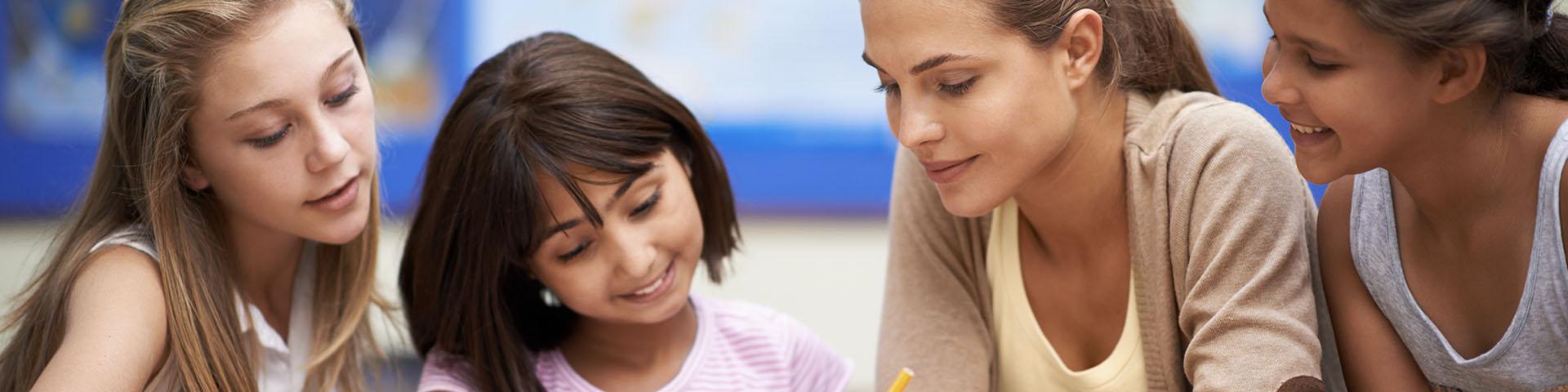 Female teacher and 3 children